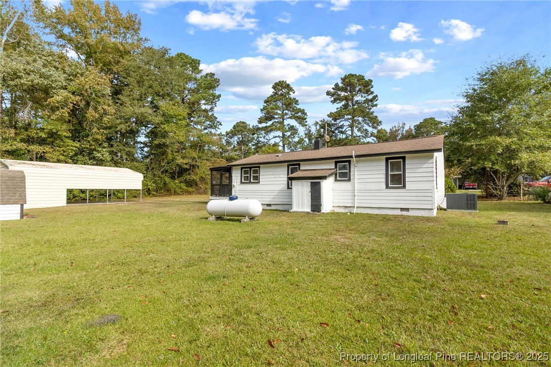 21480 Jane Shaw Road Wagram, NC 28396 - Photo 31 of 31 a view of a house with backyard and garden
