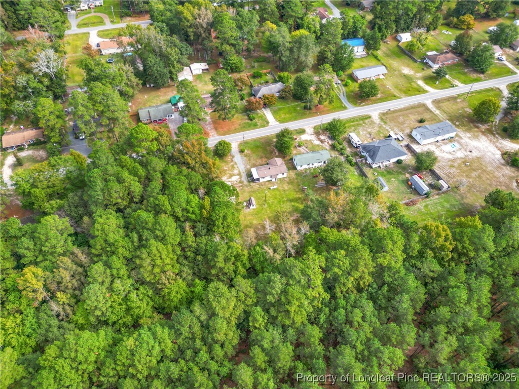 21480 Jane Shaw Road Wagram, NC 28396 - Photo 5 of 31 a backyard of a building with lots of green space