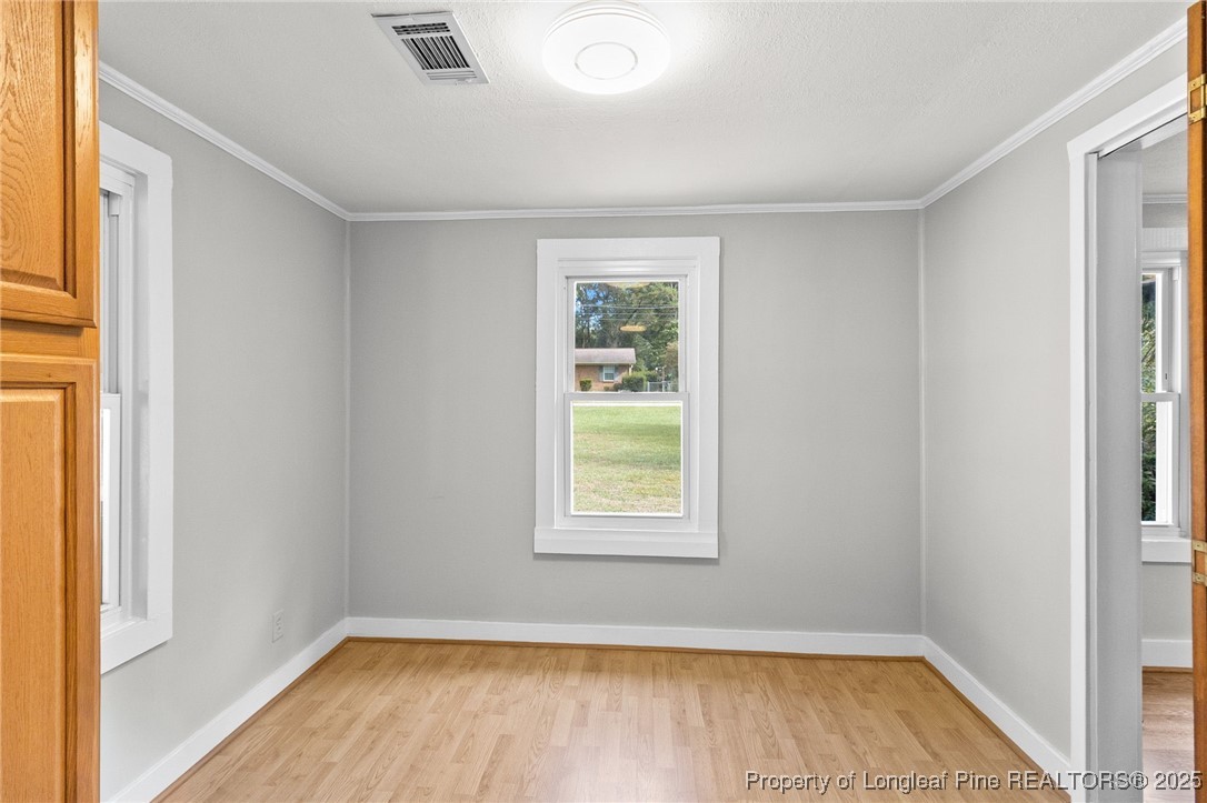 21480 Jane Shaw Road Wagram, NC 28396 - Photo 9 of 31 a view of a room that has a window in it