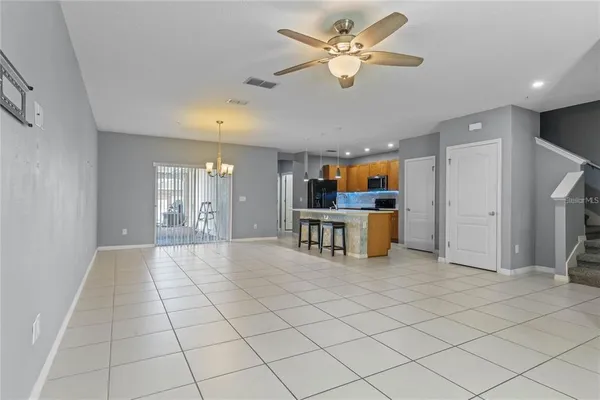 a view of a livingroom with furniture and a fan