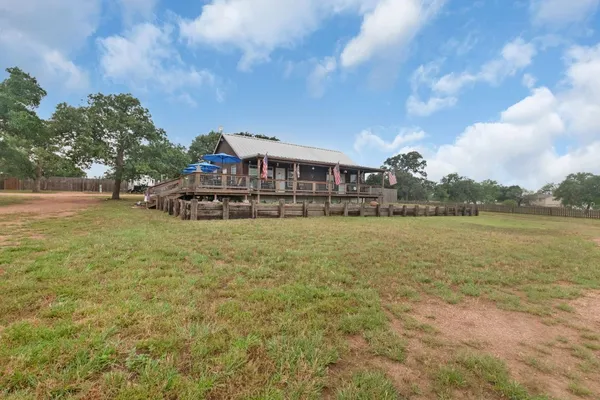 a view of a lake with a house in the background