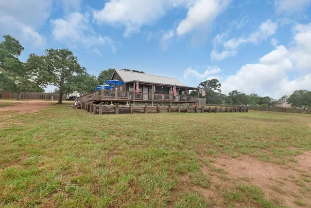 a view of a lake with a house in the background