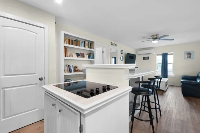 a kitchen that has a cabinets and a stove in it