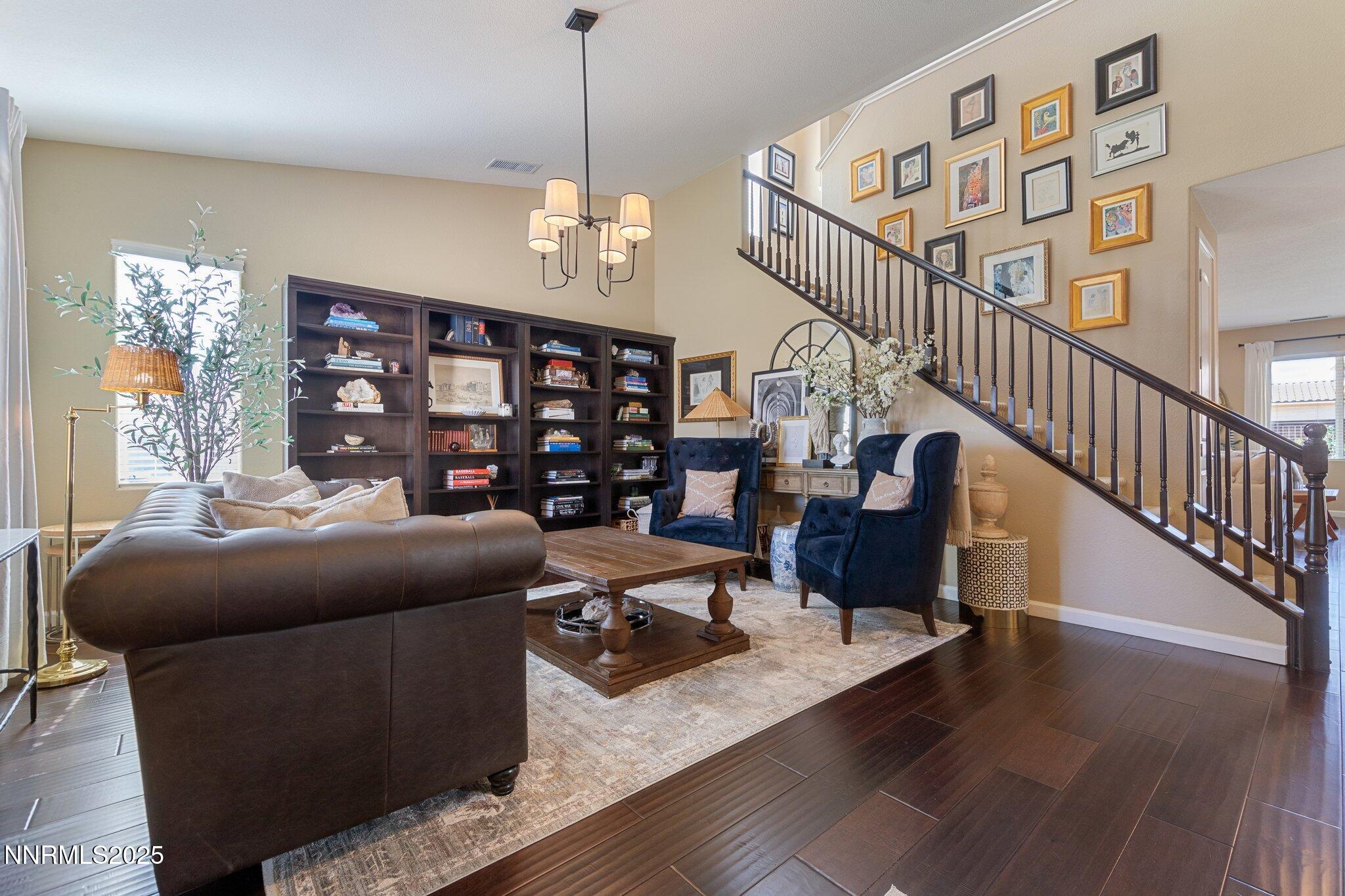 9845 Copenhagen Way Reno, NV 89521 - Photo 4 of 57 a view of a livingroom with furniture wooden floor and windows