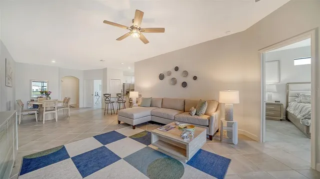 a living room with furniture and a rug