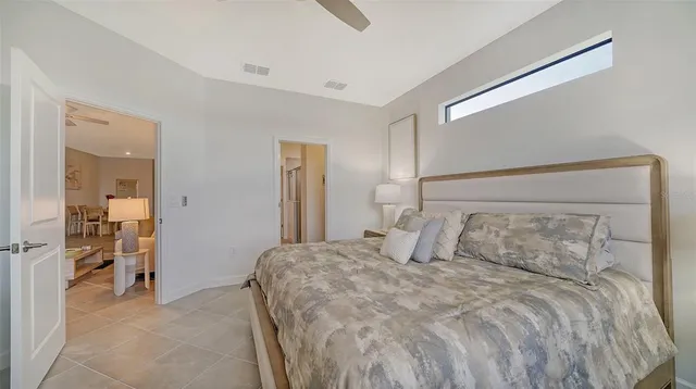 a bedroom with a bed and a walk in closet