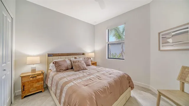 a bedroom with a bed and window