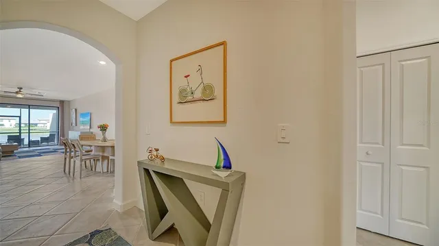 a living room with furniture a dining table and a window