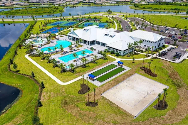 an aerial view of a pool patio swimming pool and outdoor seating