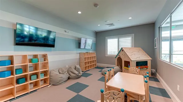 a living room with fireplace furniture and a flat screen tv
