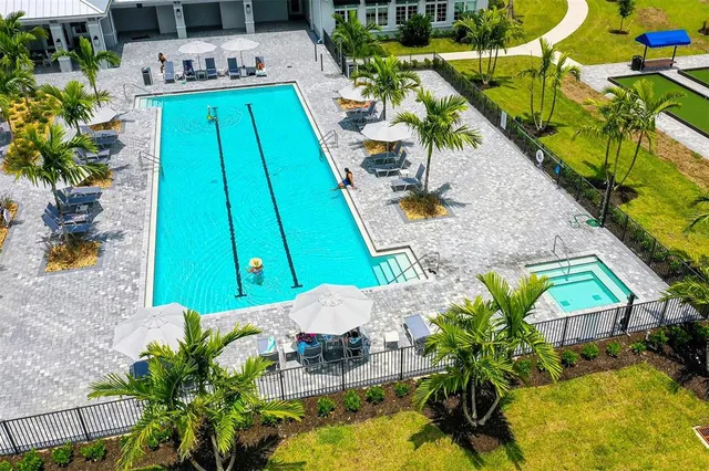 an aerial view of a swimming pool and outdoor space