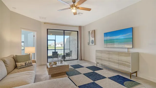 a living room with a black white checkered floor with couches and a coffee table