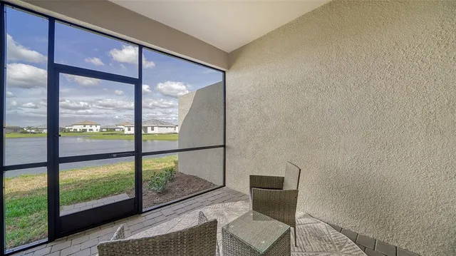 a view of a room with workspace and a window