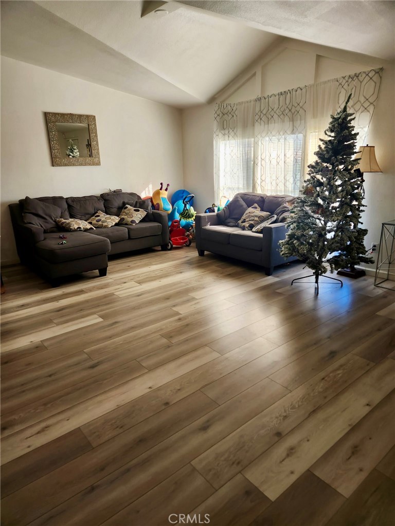 13139 Zane Way Whitewater, CA 92282 - Photo 4 of 11 a living room with furniture and a potted plant