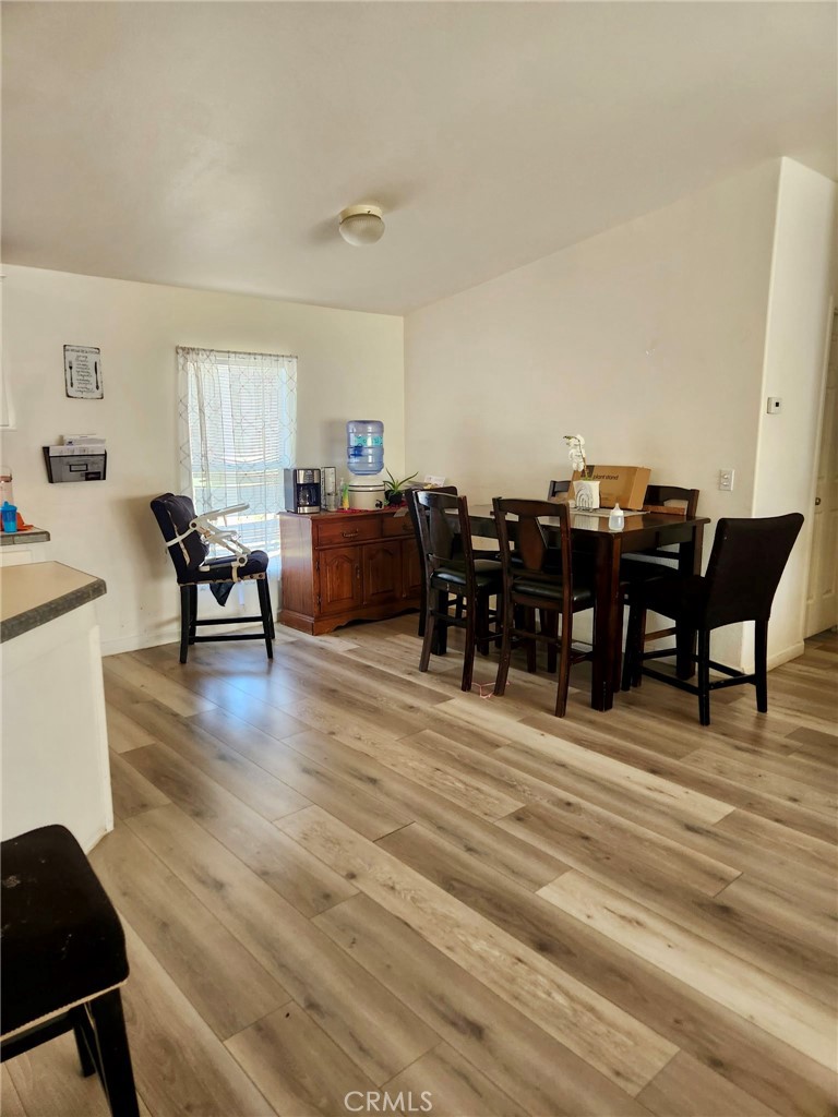 13139 Zane Way Whitewater, CA 92282 - Photo 5 of 11 a living room with furniture a dining table and a piano table