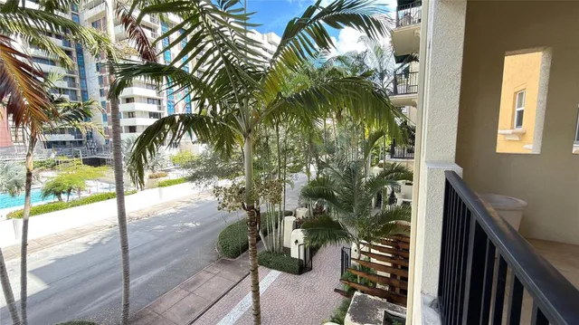 a bathroom with a granite countertop sink and shower