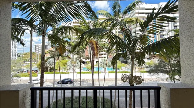 a view of a balcony with potted plants