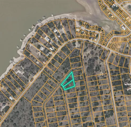 a wooden bench sitting next to a lake