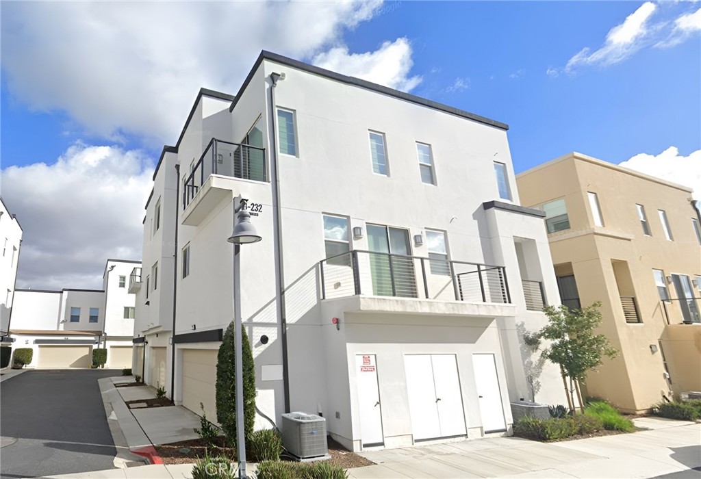 230 Harringay Irvine, CA 92618 - Photo 12 of 21 a front view of a building with a garden