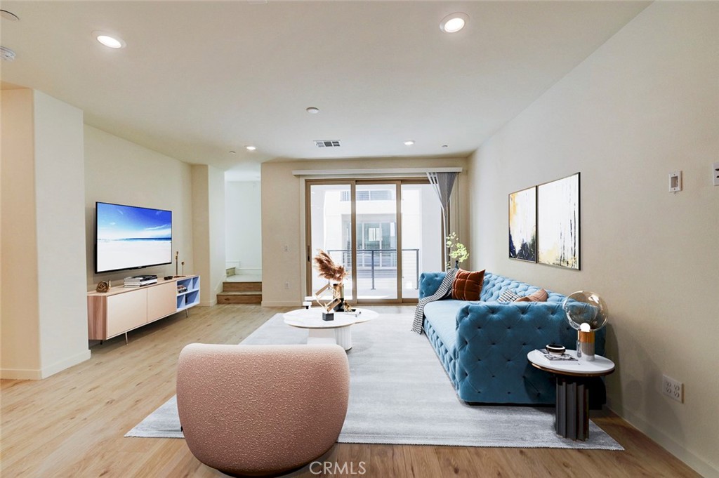 230 Harringay Irvine, CA 92618 - Photo 2 of 21 a living room with furniture and a flat screen tv