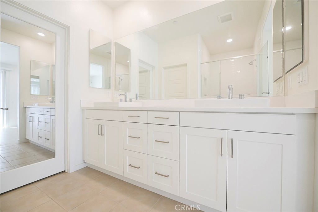 230 Harringay Irvine, CA 92618 - Photo 8 of 21 a bathroom with a sink vanity and mirror