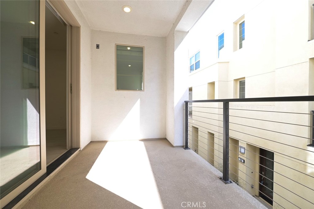 230 Harringay Irvine, CA 92618 - Photo 9 of 21 a view of a hallway with washer and dryer