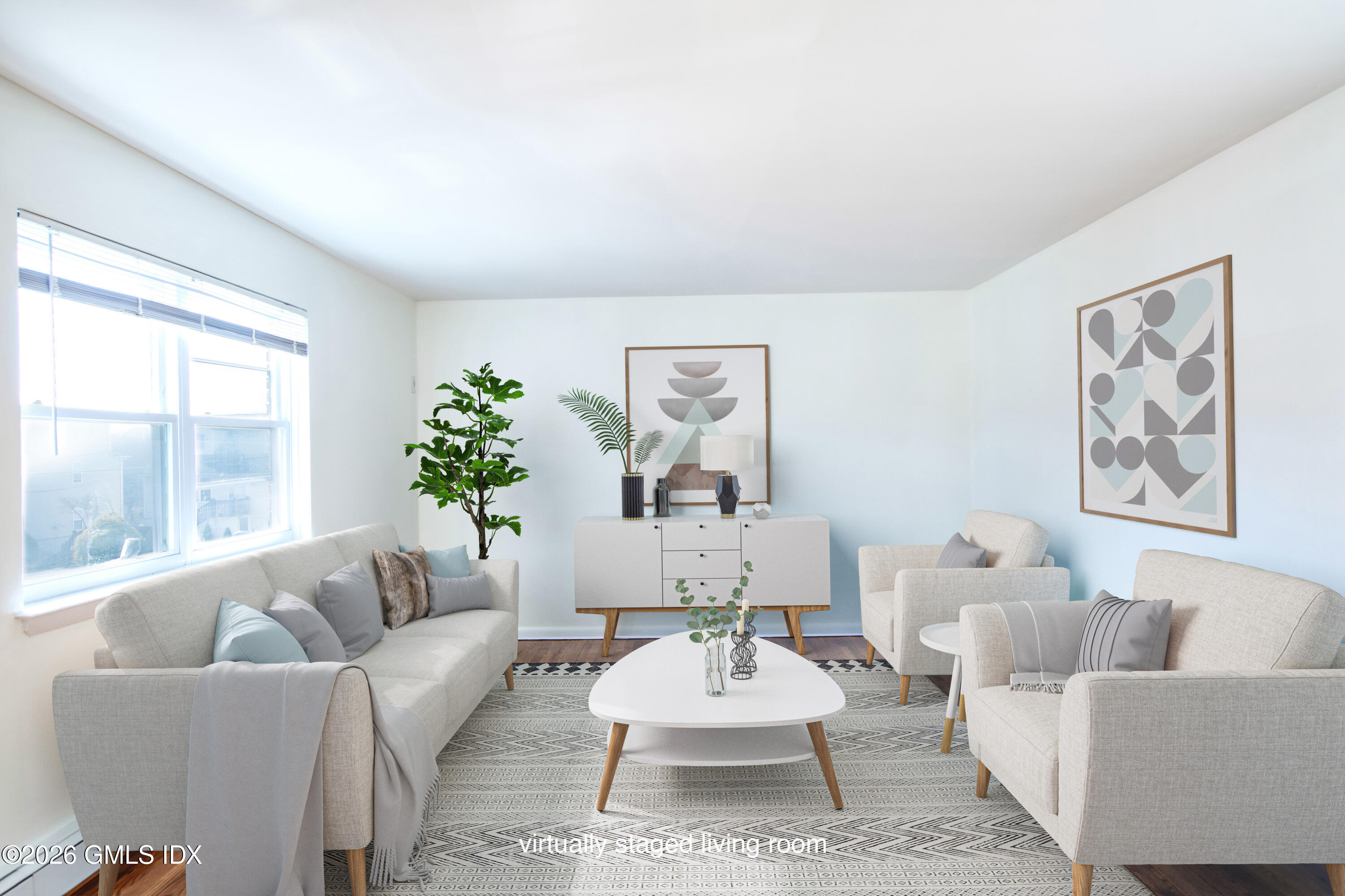 25 Alexander Street, Unit B Greenwich, CT 06830 - Photo 1 of 26 a living room with furniture potted plant and window
