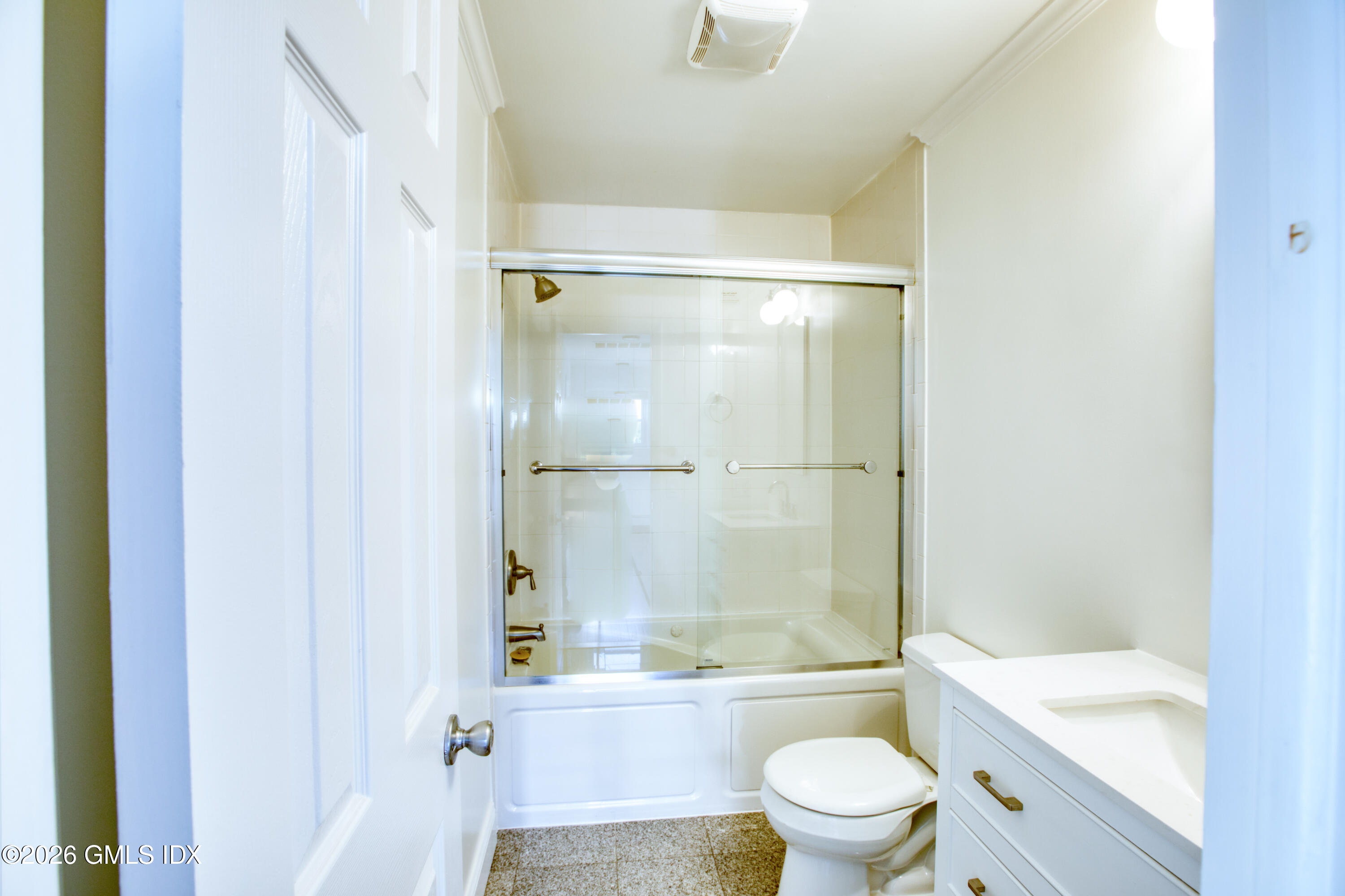 25 Alexander Street, Unit B Greenwich, CT 06830 - Photo 13 of 26 a bathroom with a bathtub shower sink mirror and toilet