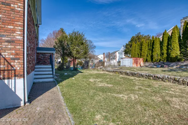 a view of a backyard of the house
