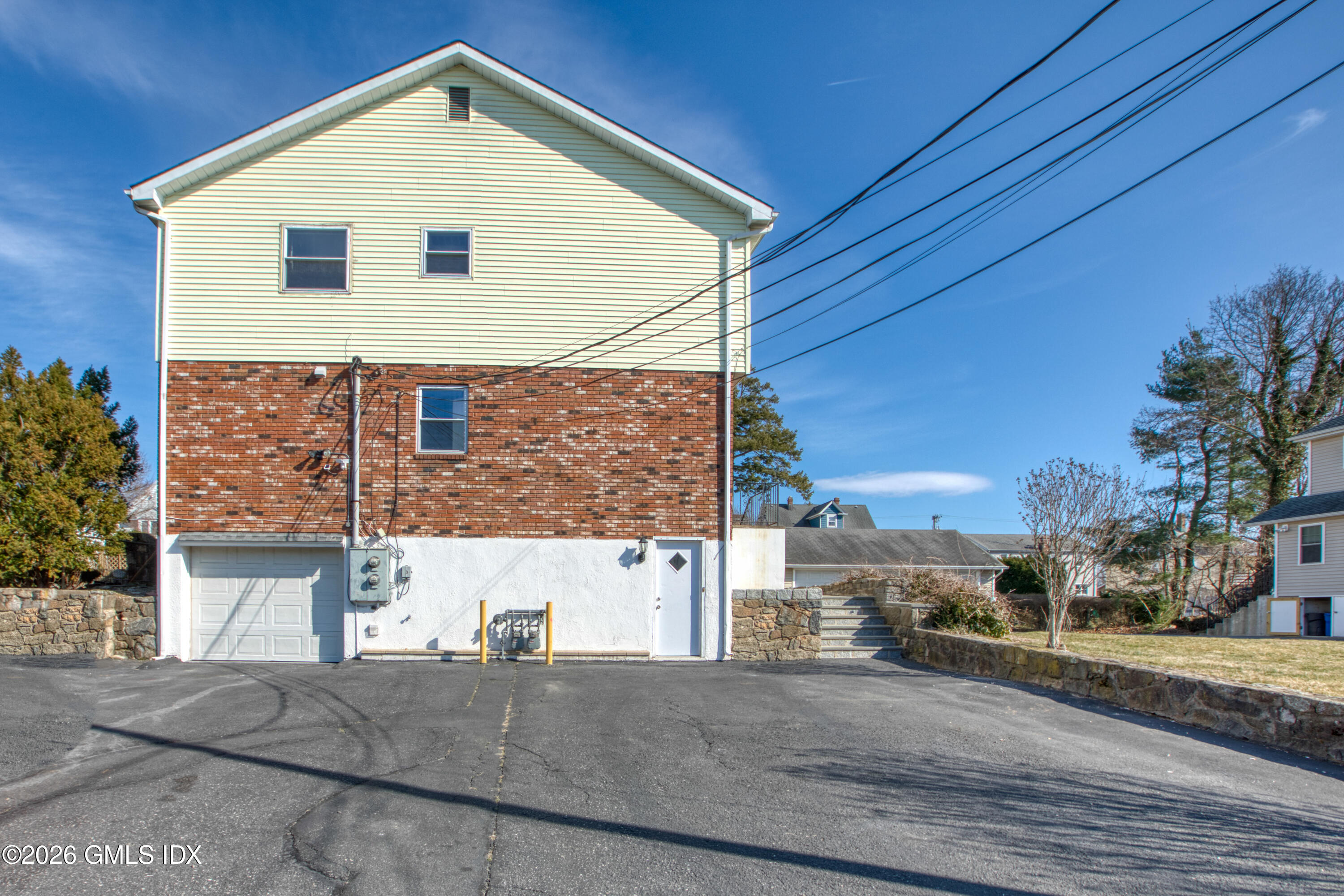 25 Alexander Street, Unit B Greenwich, CT 06830 - Photo 22 of 26 a view of a house with a yard