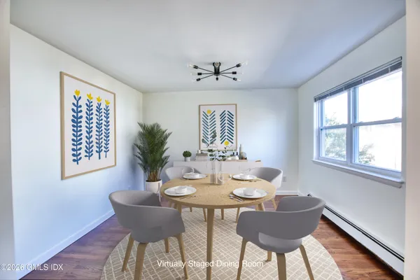 a view of a dining room with furniture window and outside view