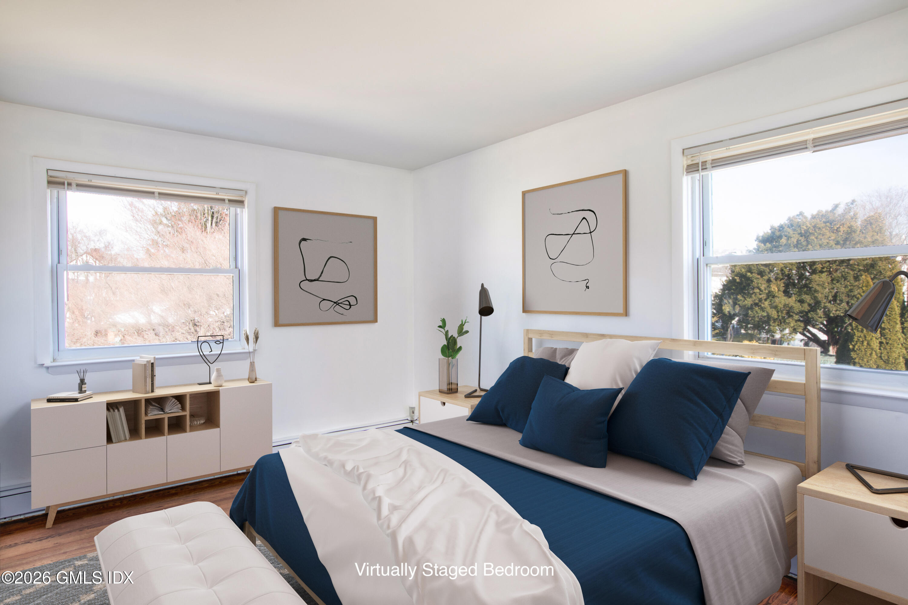 25 Alexander Street, Unit B Greenwich, CT 06830 - Photo 6 of 26 a living room with a bed furniture and a window