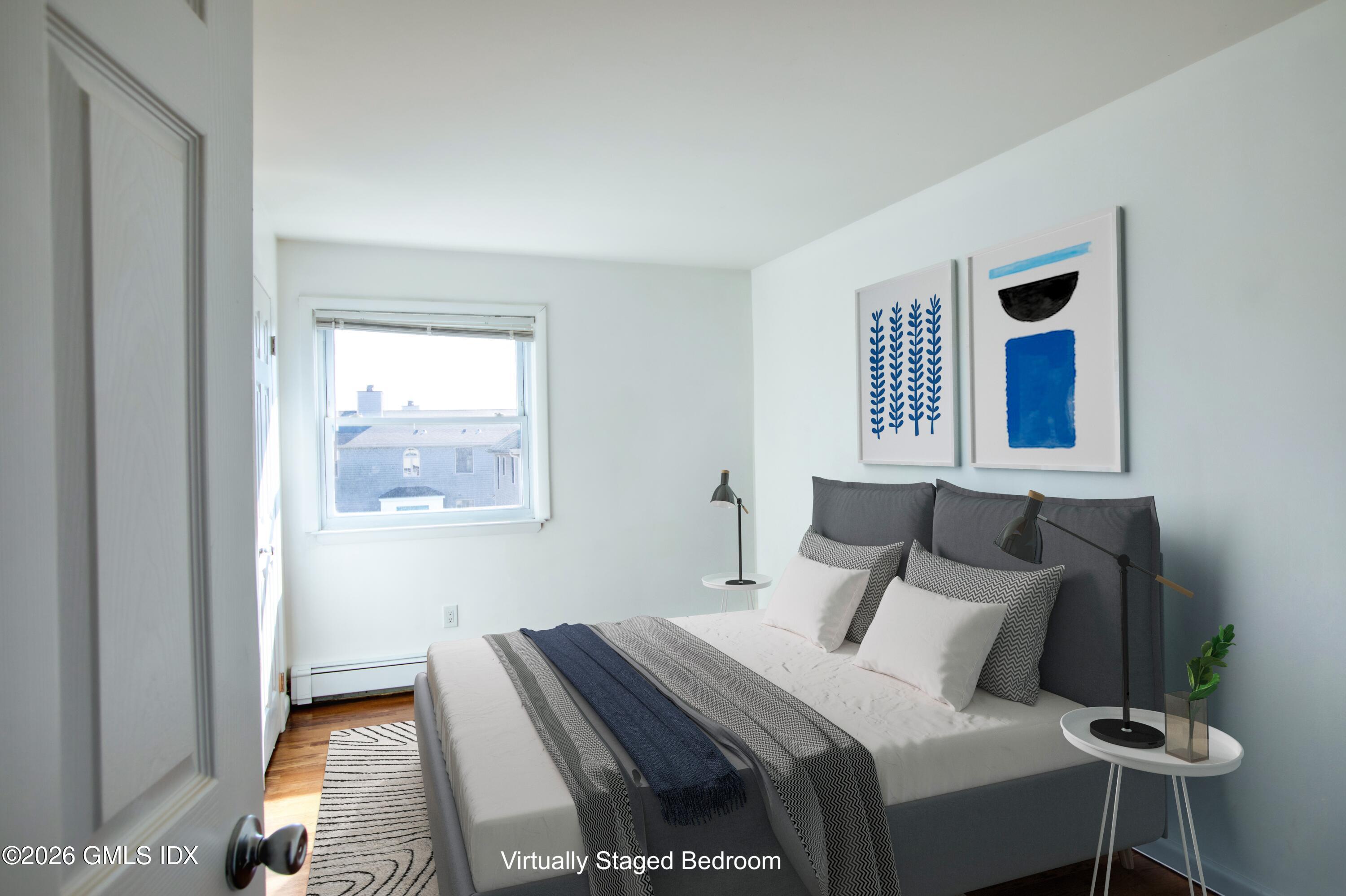 25 Alexander Street, Unit B Greenwich, CT 06830 - Photo 8 of 26 a bedroom with a bed and a window