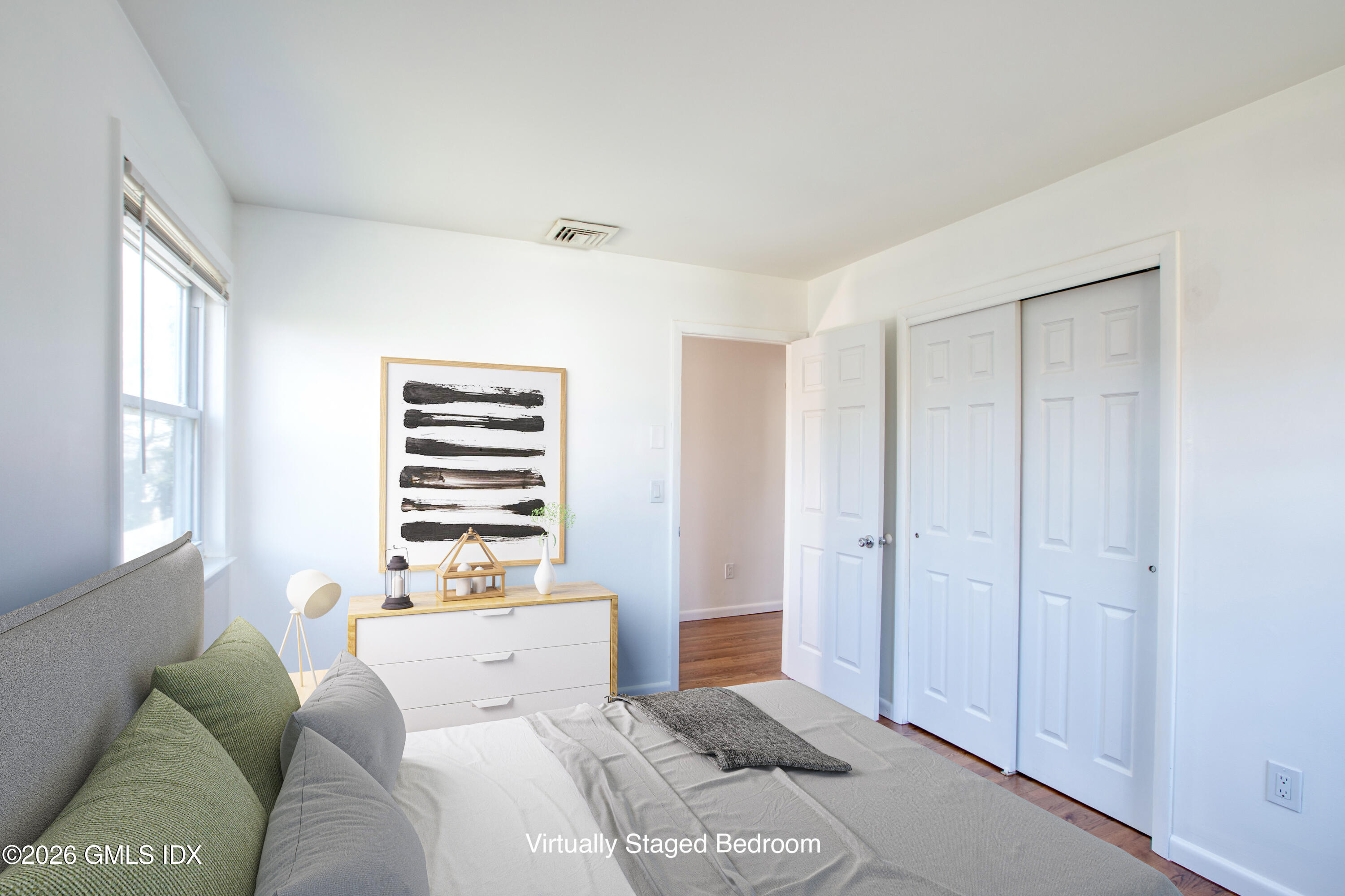 25 Alexander Street, Unit B Greenwich, CT 06830 - Photo 10 of 26 a bedroom with a bed and a window