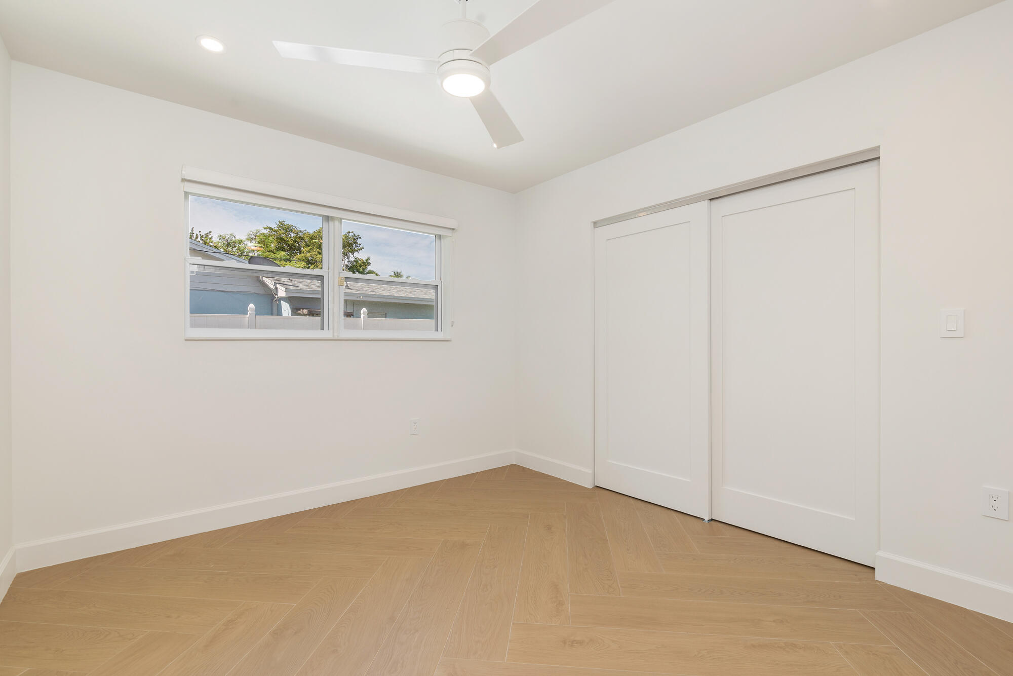 7320 Clarke Road West Palm Beach, FL 33406 - Photo 13 of 38 an empty room with a window and wall painting