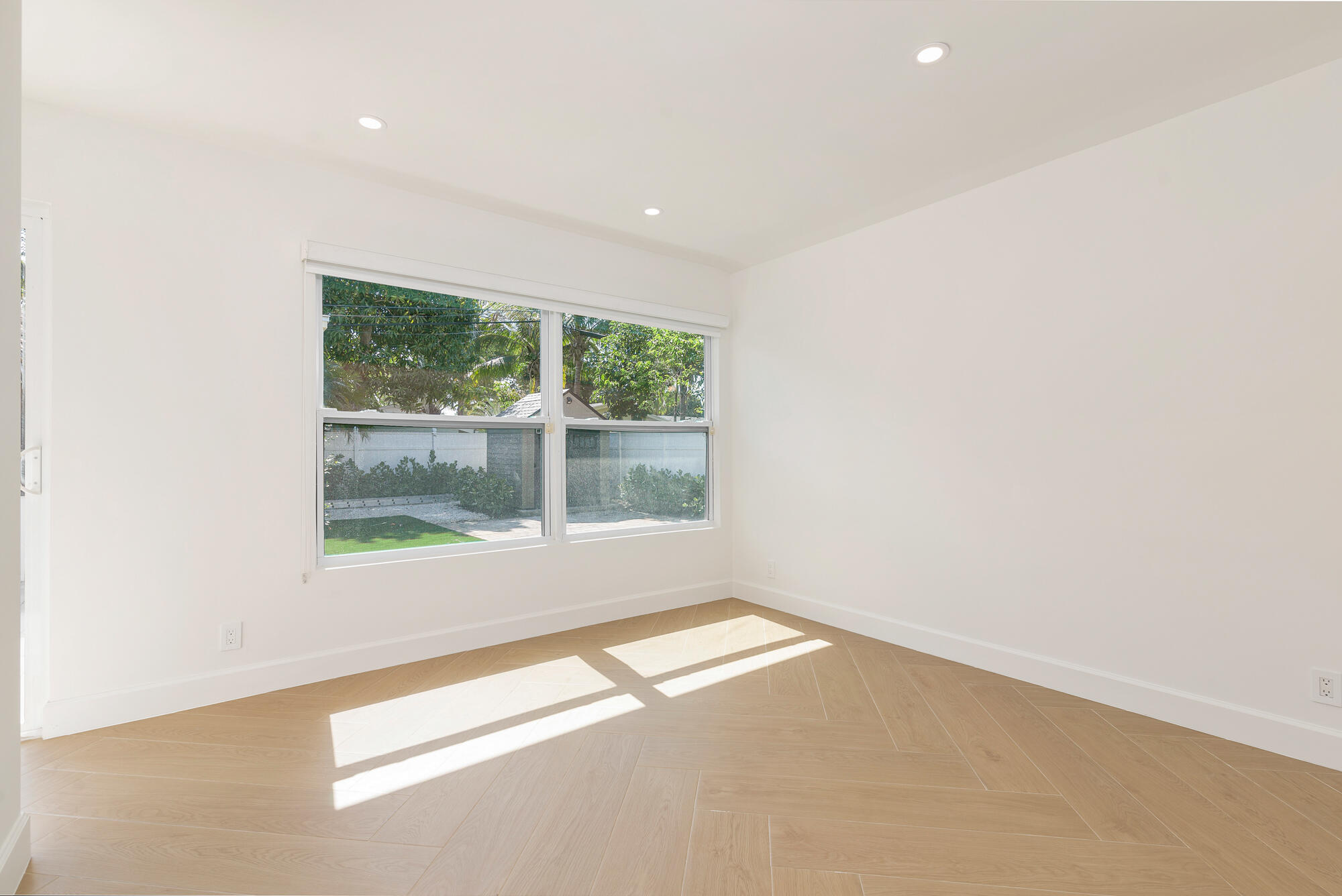 7320 Clarke Road West Palm Beach, FL 33406 - Photo 17 of 38 an empty room with a window