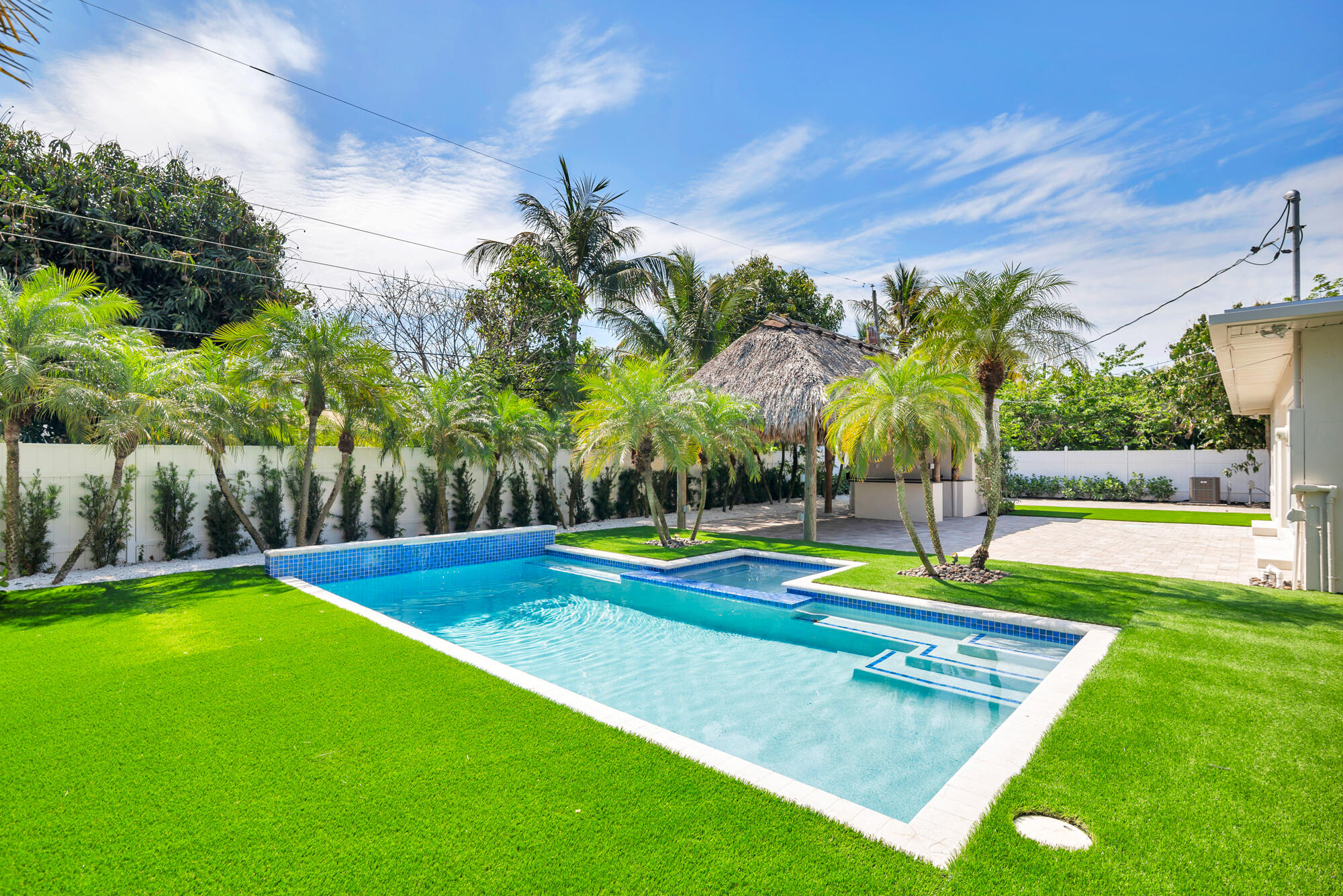7320 Clarke Road West Palm Beach, FL 33406 - Photo 23 of 38 a view of a backyard with swimming pool