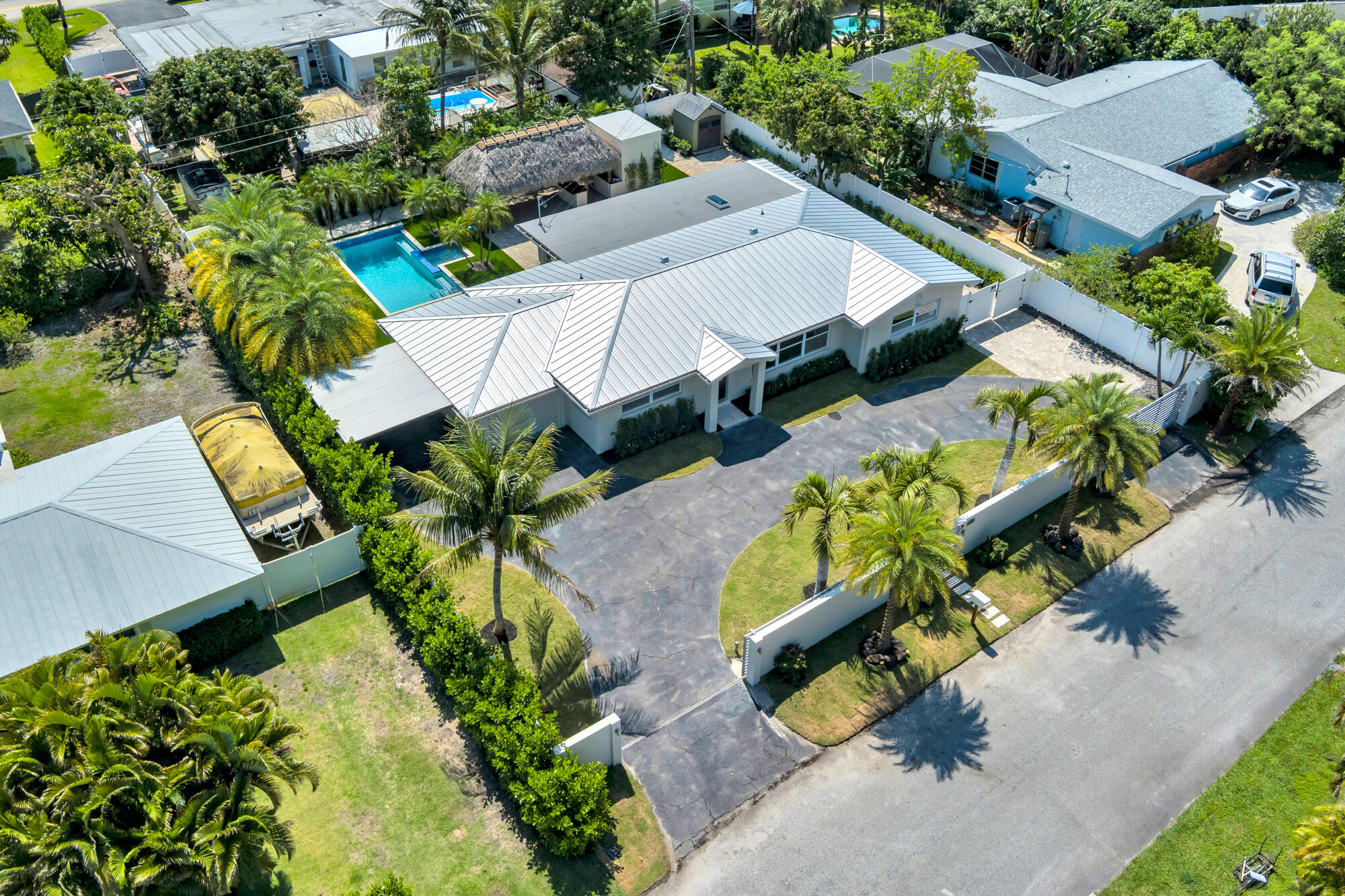 7320 Clarke Road West Palm Beach, FL 33406 - Photo 28 of 38 an aerial view of a house with a garden and plants
