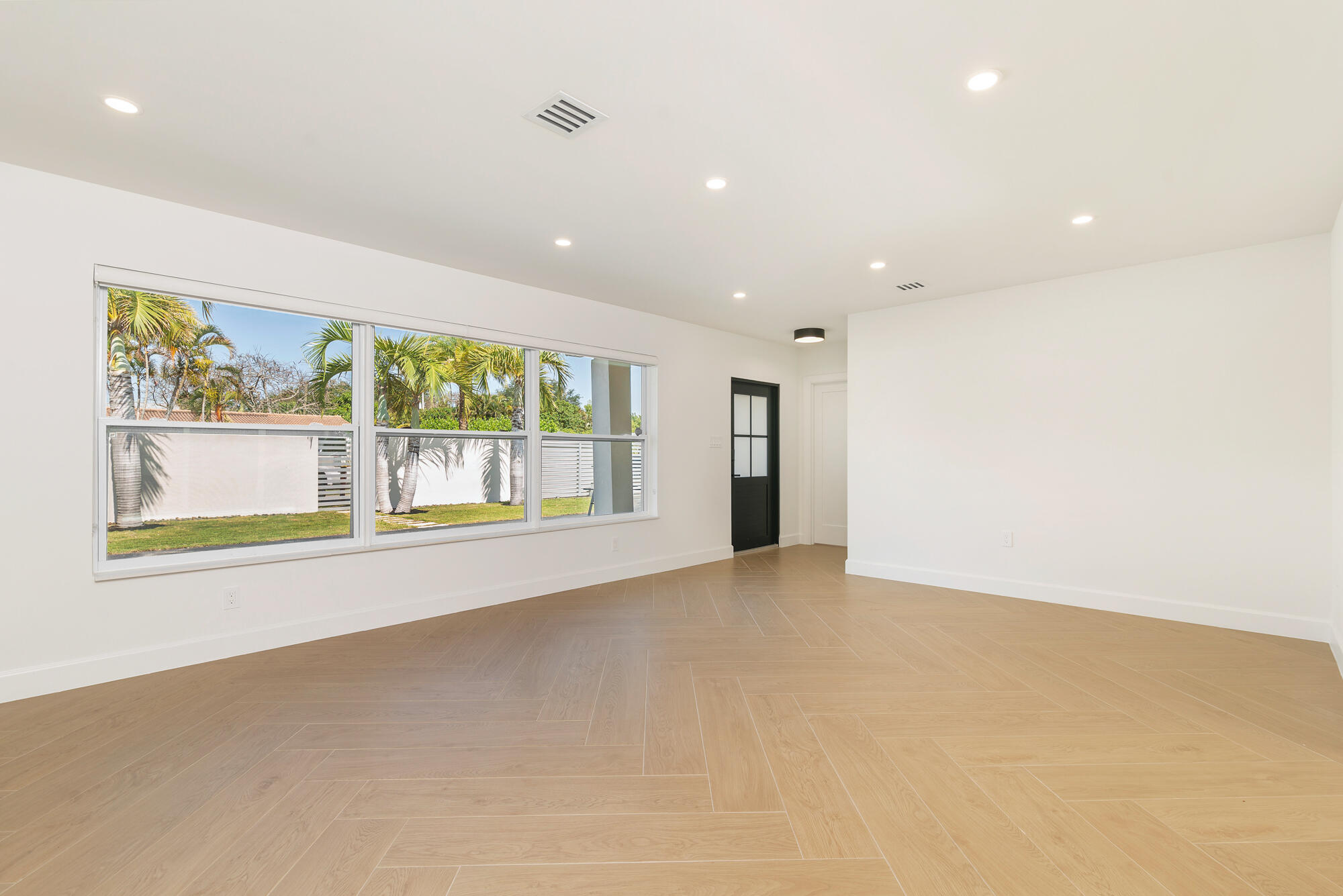 7320 Clarke Road West Palm Beach, FL 33406 - Photo 5 of 38 an empty room with large windows