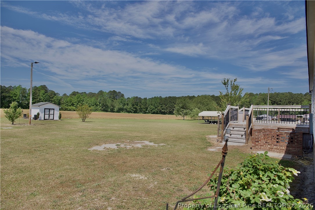 1071 Watts Road Lumberton, NC 28360 - Photo 28 of 31 a view of a lake with a building in the back