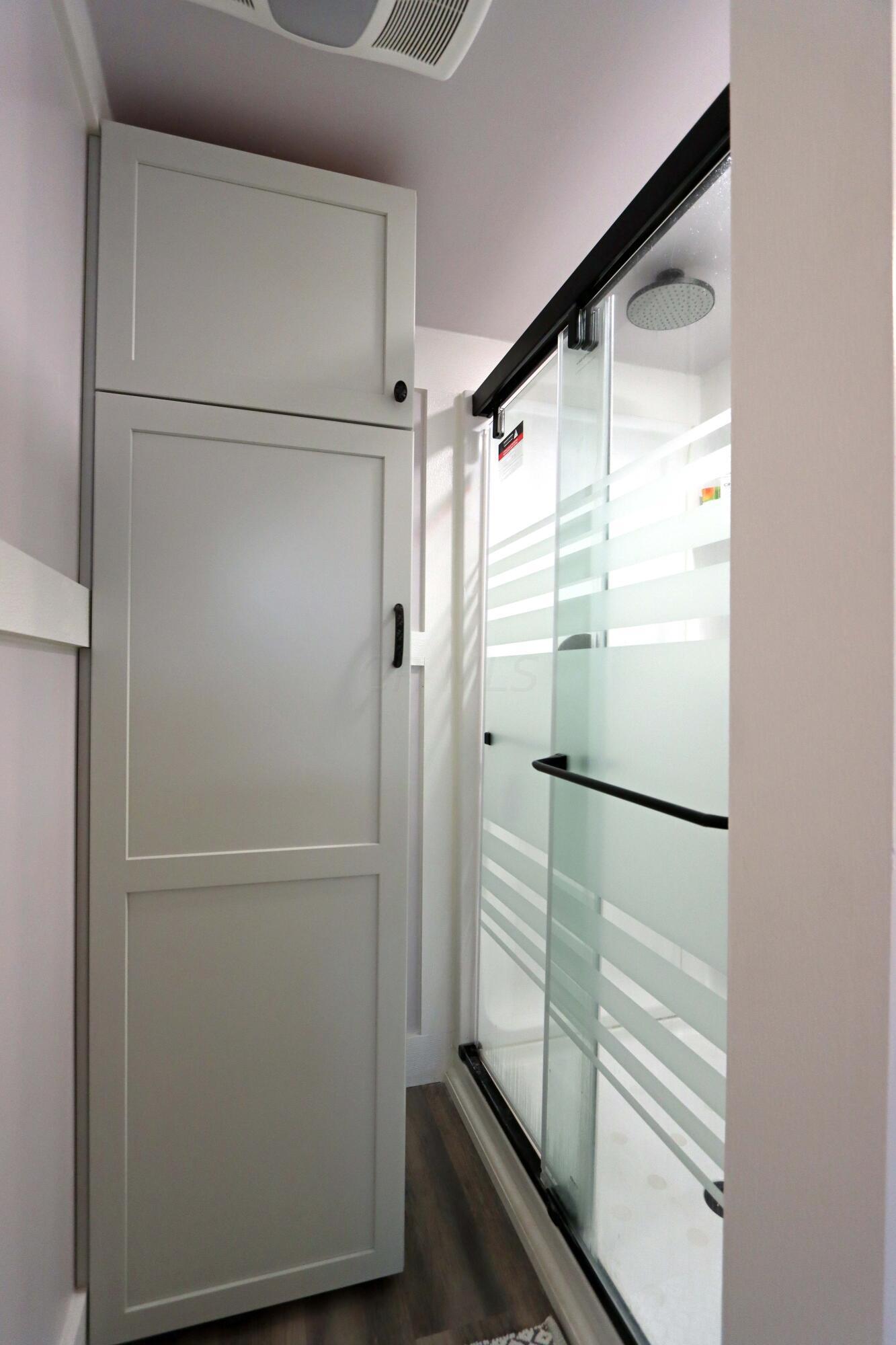 2717 Tudor Road Columbus, OH 43209 - Photo 33 of 51 Glass door shower, cabinets