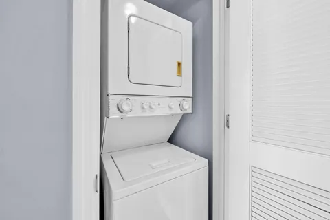 a balcony with table and chairs