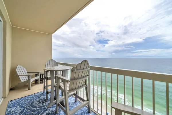 a view of a balcony with furniture