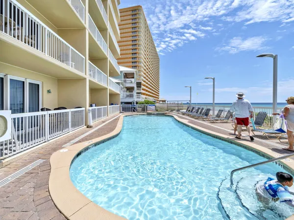 a view of a swimming pool with a chair
