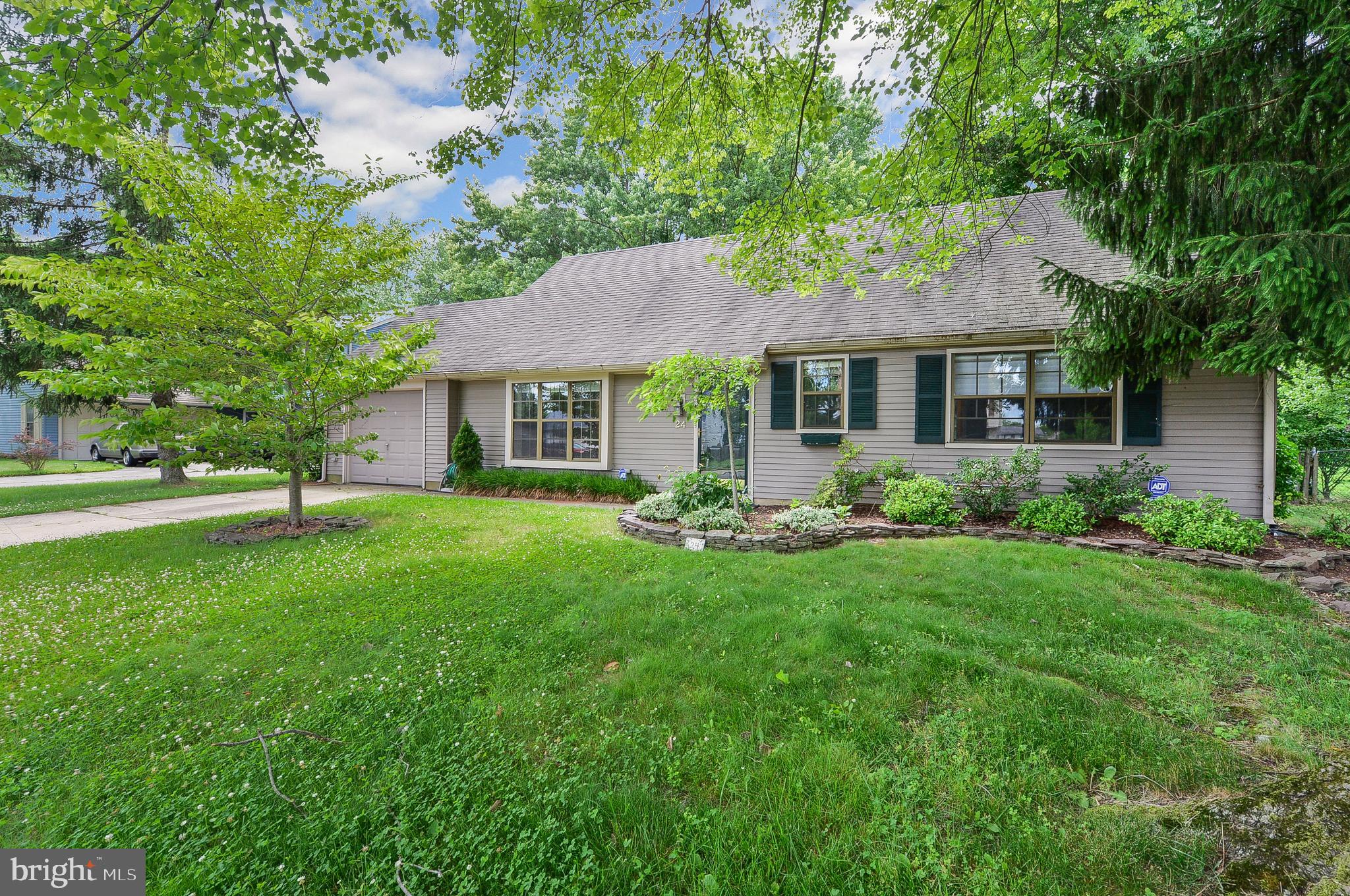 24 Dover Road Westampton, NJ 08060 - Photo 1 of 23 a front view of a house with a garden and yard