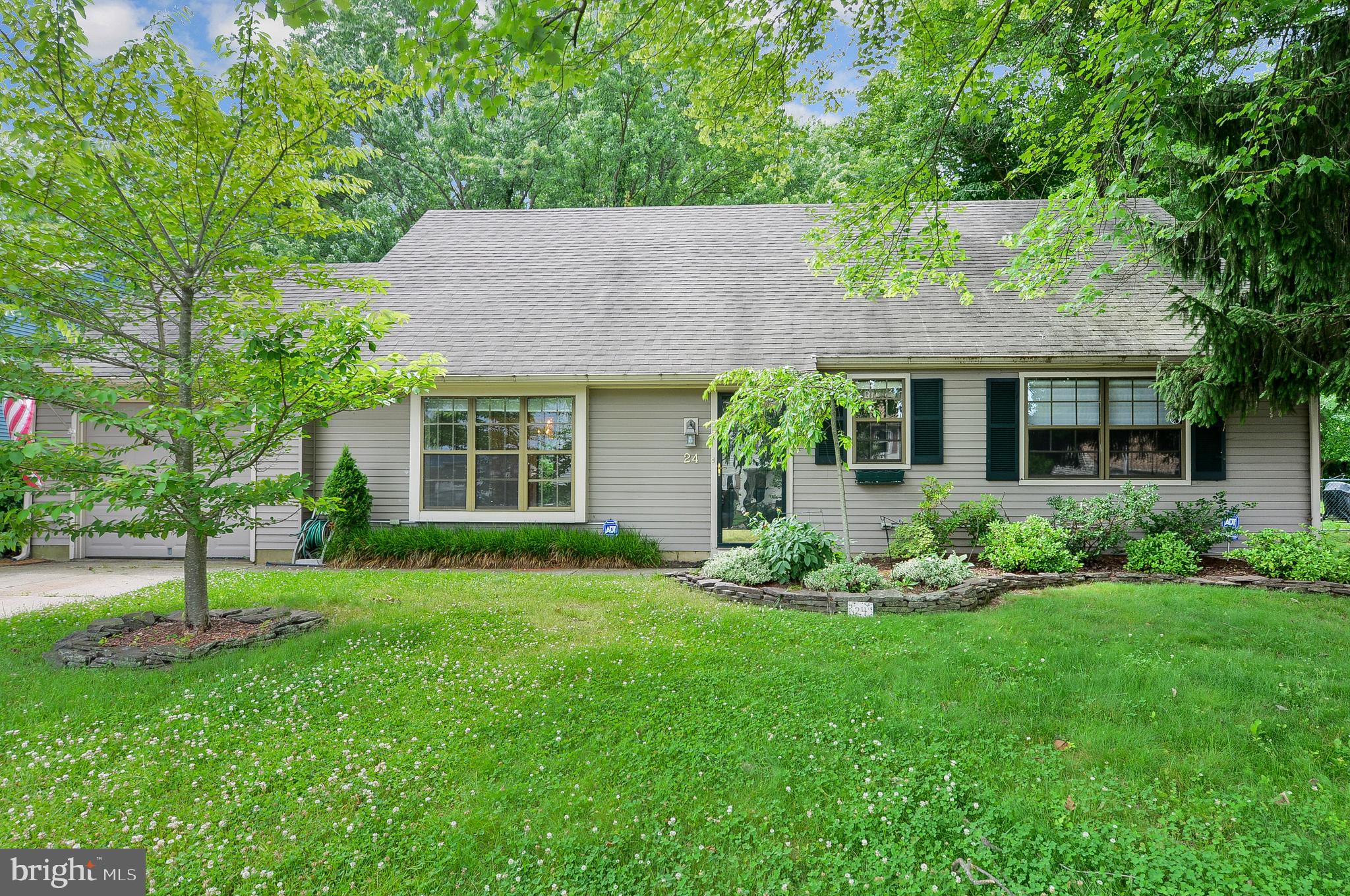 24 Dover Road Westampton, NJ 08060 - Photo 2 of 23 a front view of a house with a garden and yard