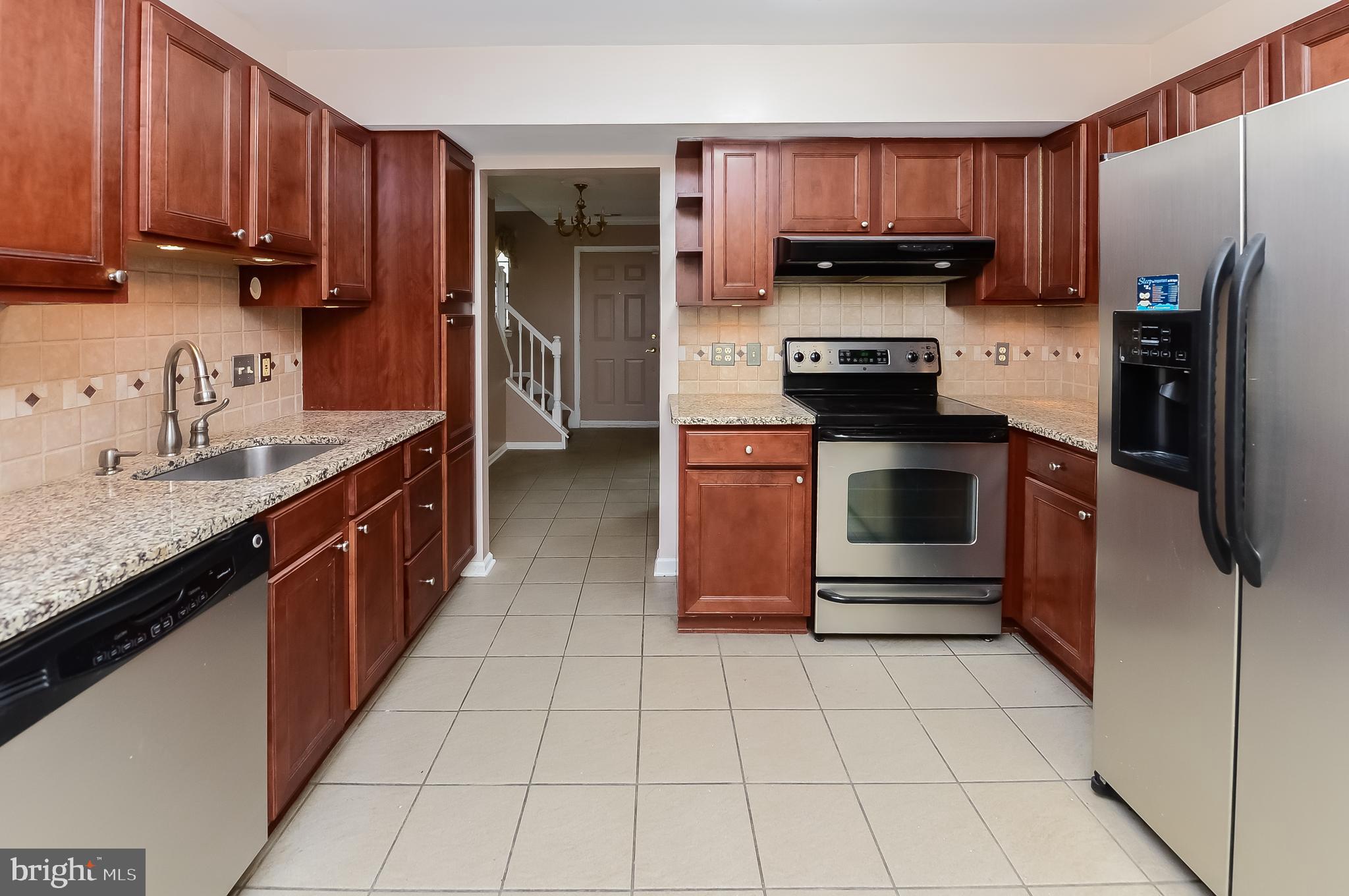 24 Dover Road Westampton, NJ 08060 - Photo 11 of 23 a kitchen with stainless steel appliances granite countertop a stove a refrigerator and a sink