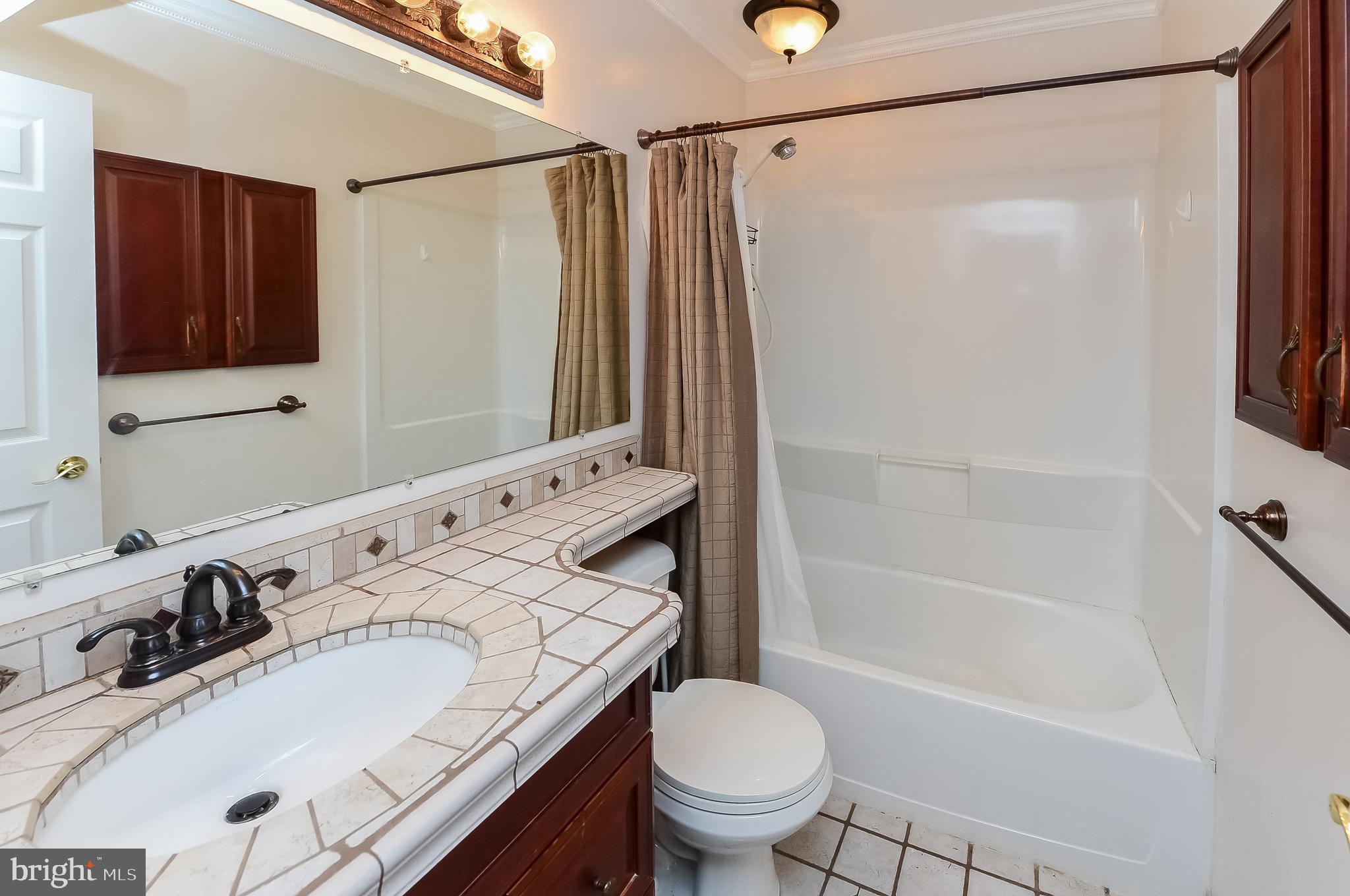 24 Dover Road Westampton, NJ 08060 - Photo 17 of 23 a bathroom with a sink toilet and shower