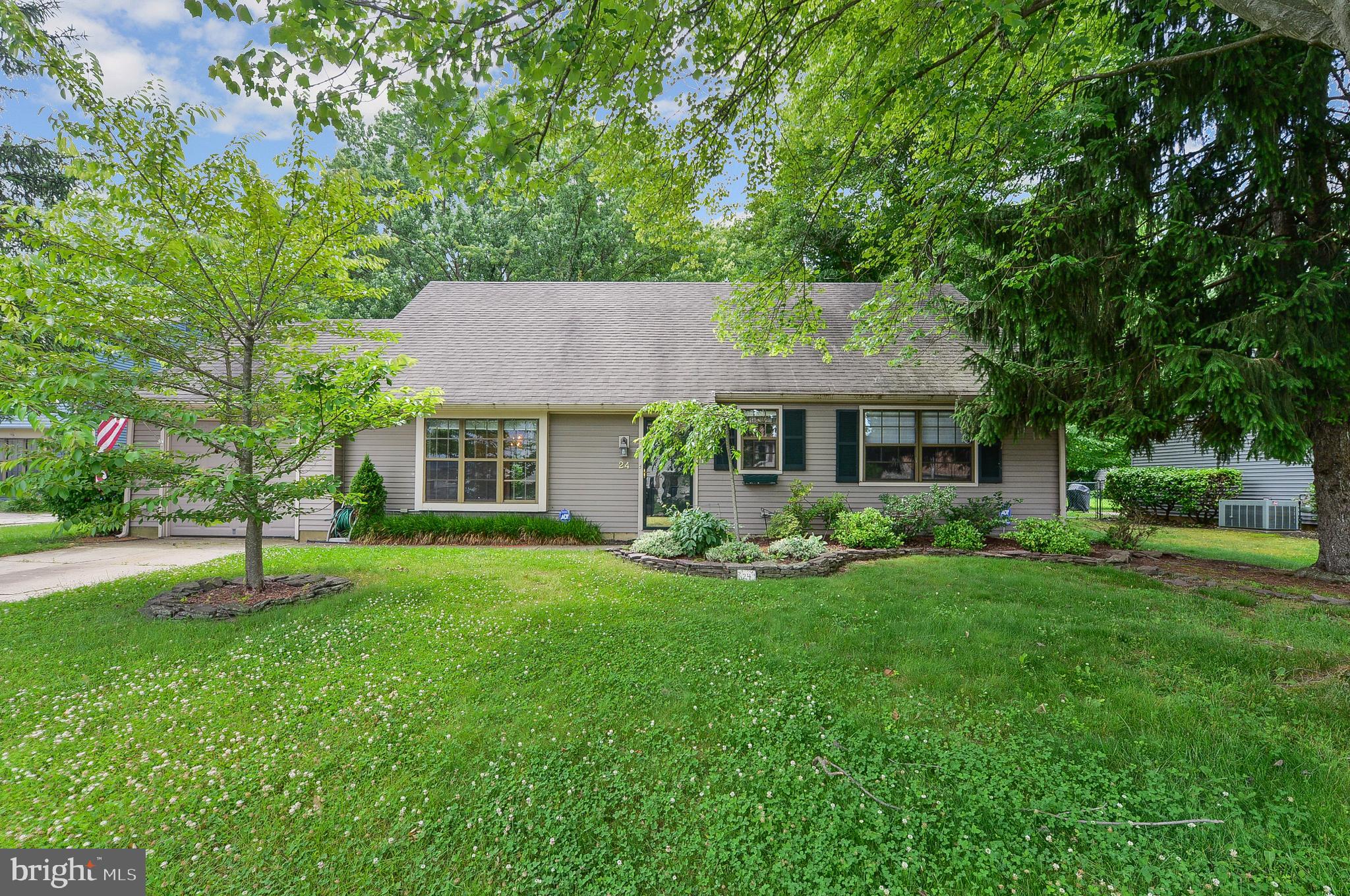 24 Dover Road Westampton, NJ 08060 - Photo 3 of 23 a front view of a house with a garden and trees