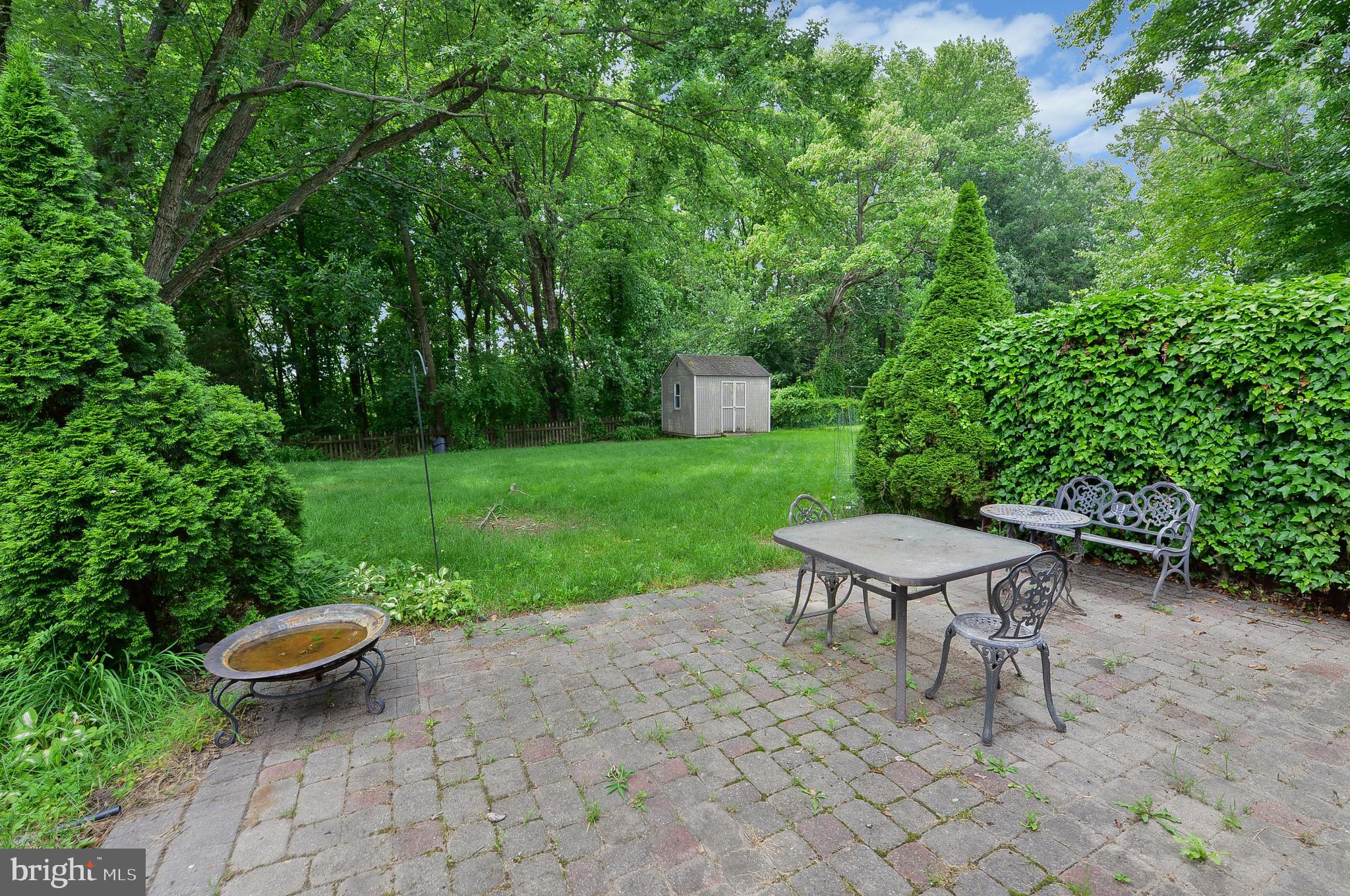24 Dover Road Westampton, NJ 08060 - Photo 9 of 23 a view of a backyard with table and chairs and a fire pit